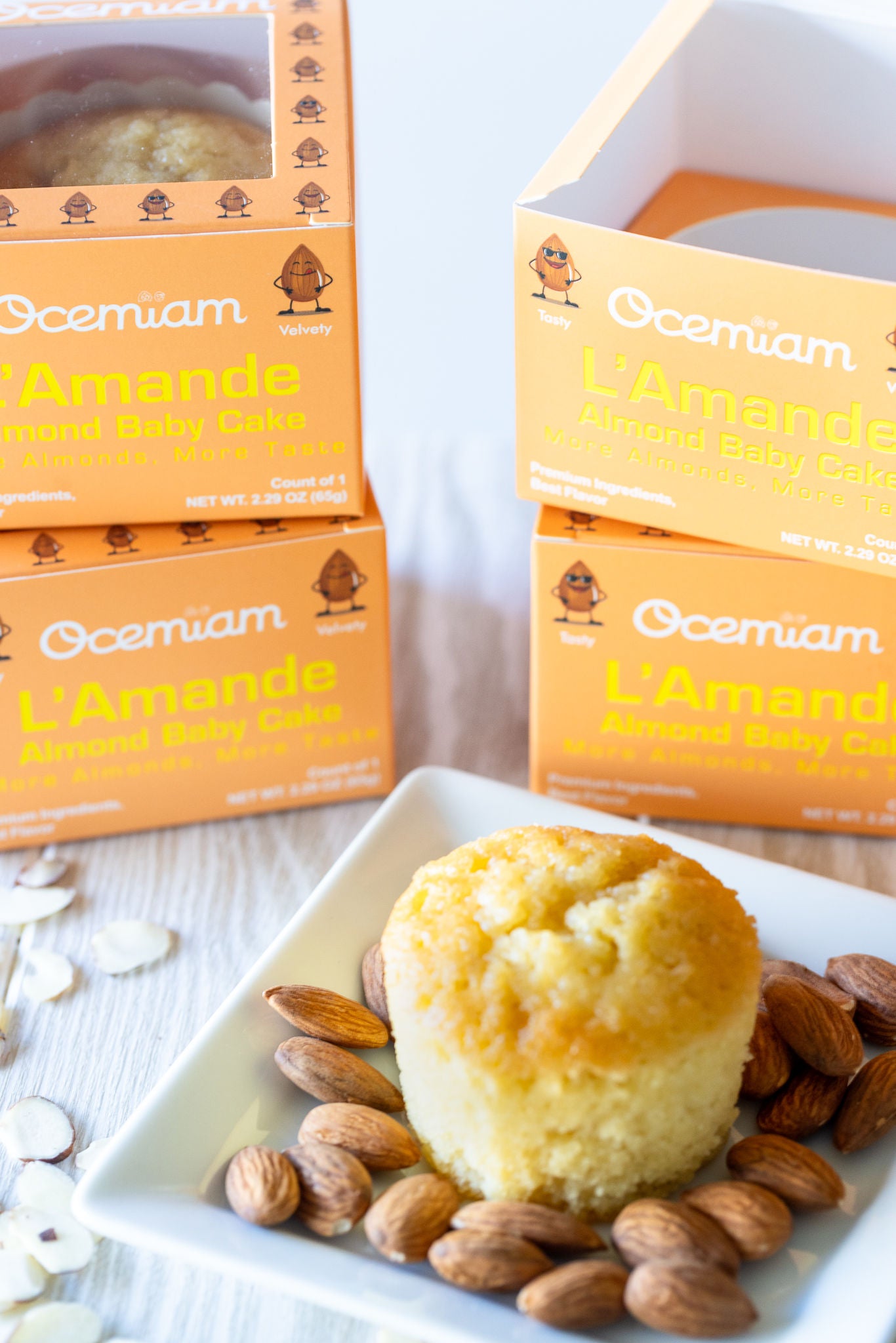 Ocemian L'Amande almond butter cake with packaging on a white plate